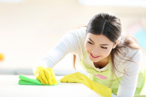 Supervisor checking cleaning equipment and workplace safety standards